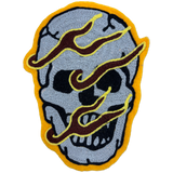 Hand-made chainstitch patch depicting a flaming skull.