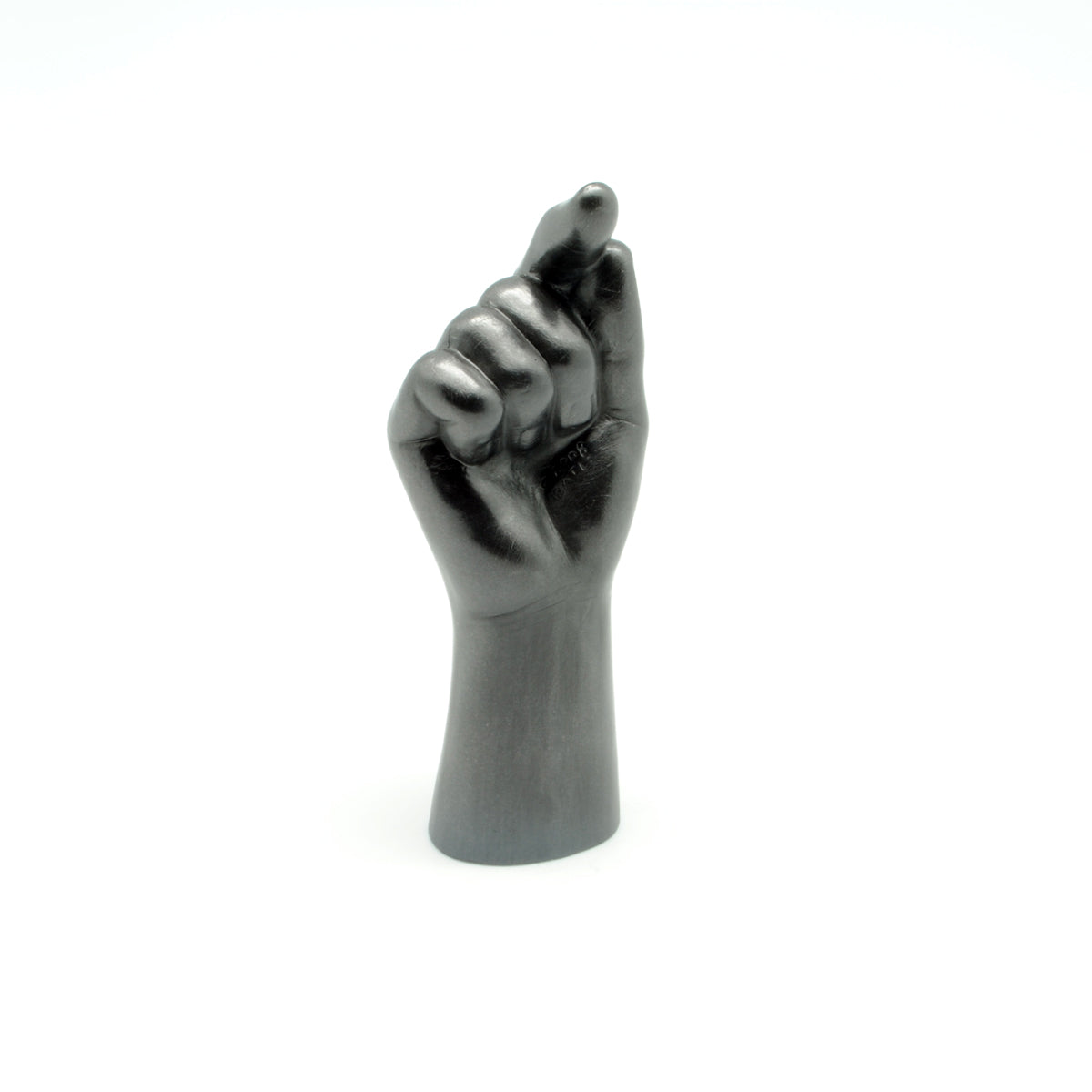 Black graphite hand sculpture with a raised index finger on a white background