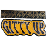 A black and gold patterned fabric headband shown above a matching black and yellow 'GITTY UP' patch on a white background.