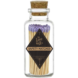 Glass jar with cork lid containing lavender-tipped safety matches branded 'The Lost Wax Co'.