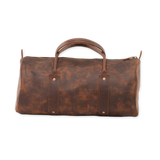 A brown distressed leather duffel bag with a top handle, shown against a plain white background.